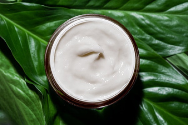 228373705-jar-of-natural-cosmetic-cream-on-green-leaves-as-background-organic-vegan-skin-care-concept-eco.jpg